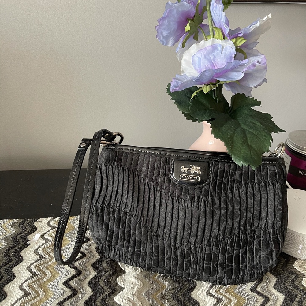 Medium Coach Wrislet with beautiful plum interior